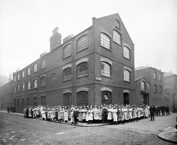 A building with the whole workforce stood outside