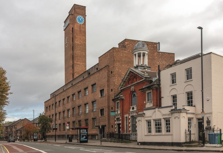 A redbrick deco building with a clocktower