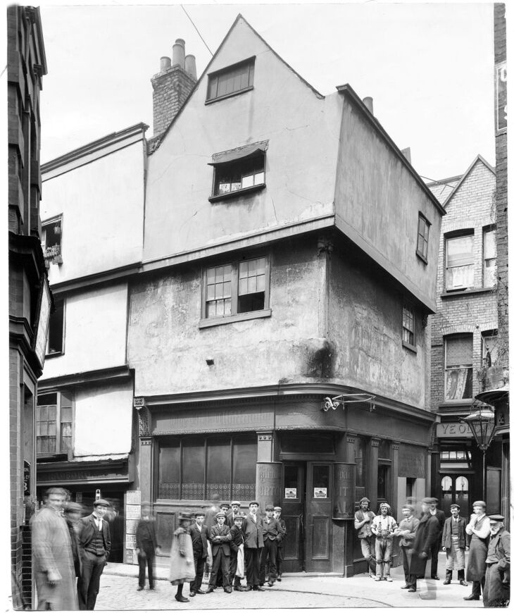 People standing outside a pub