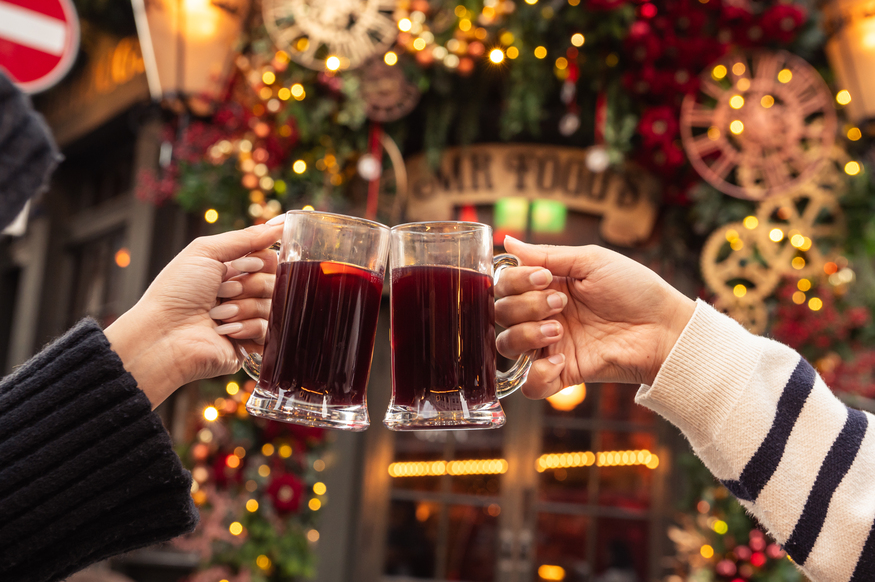 Two glasses of mulled wine being cheersed