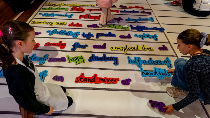 Free events in London this week: children moving words around on a large board on the floor