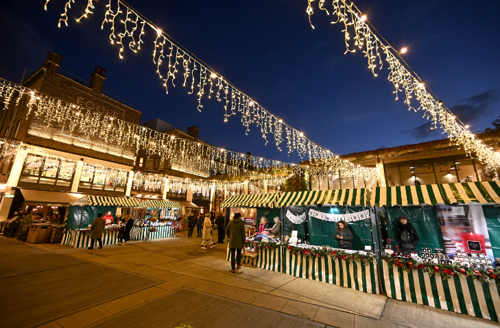 London Christmas markets 2025: Stalls beneath a criss-cross of fairy lights in Eccleston Yards