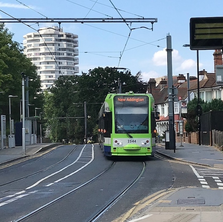 A tram runs through croydon