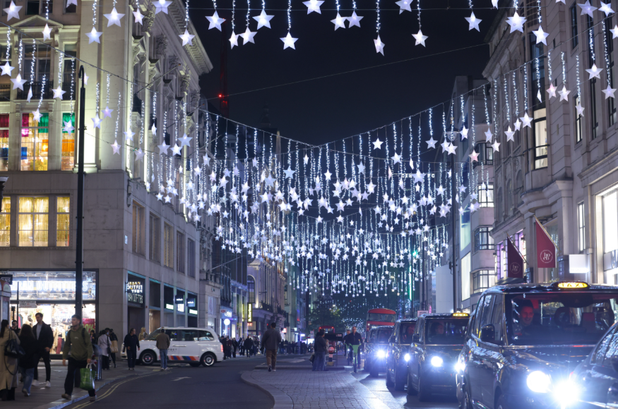 Oxford Street Christmas lights 2025: people and traffic beneath glowing stars on Oxford Street