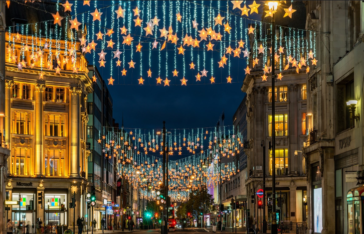 London Christmas lights 2025: Star-themed Christmas lights dangling above Oxford Street 