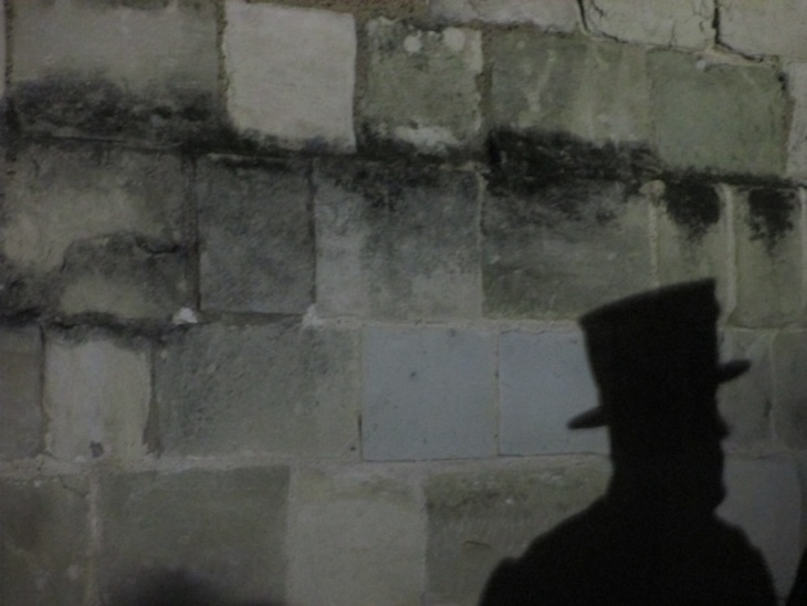 Shadow of a beefeater's head at Tower of London