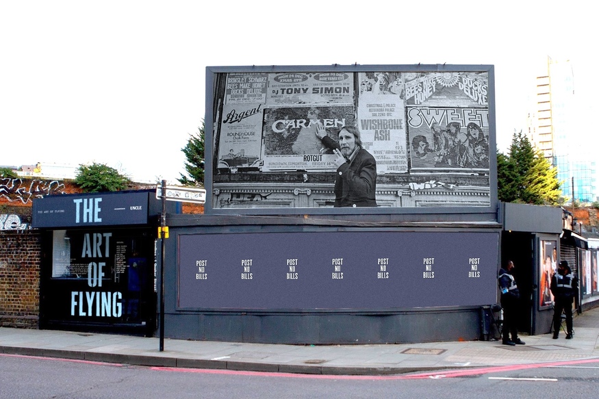 A billboard featuring Terry 'The Pill' Slater, one of London's legendary fly-posters.