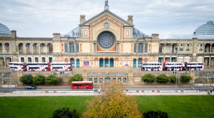 Buses decorated with poppies parked outside Alexandra Palace