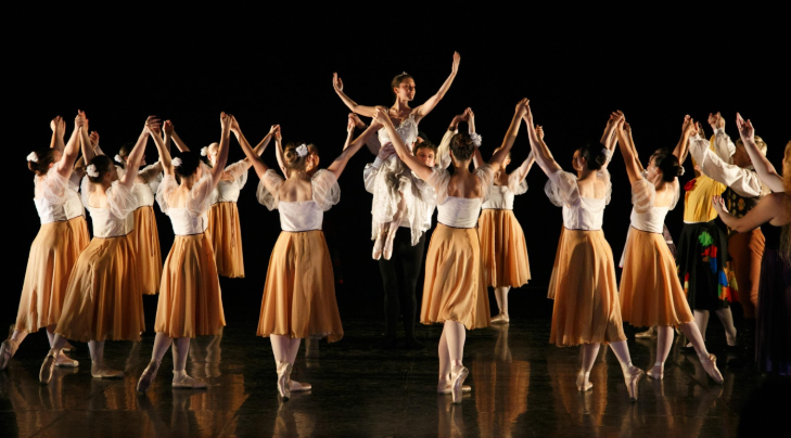 Thing to do in London today: a large group of dancers holding hands in a circle