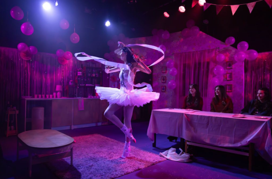 Thing to do in London today: a performer dressed as a ballerina on stage