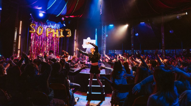 Things to do in London in November 2025:  a woman dancing in the aisles at a theatre show