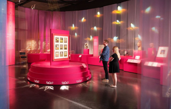 Things to do in London this weekend:  two people looking at a display within an exhibition