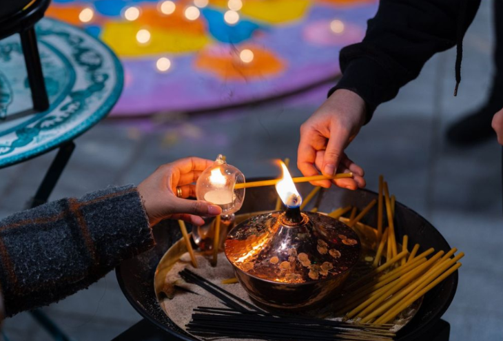 Things to do in London this weekend: a lamp being lit for Diwali