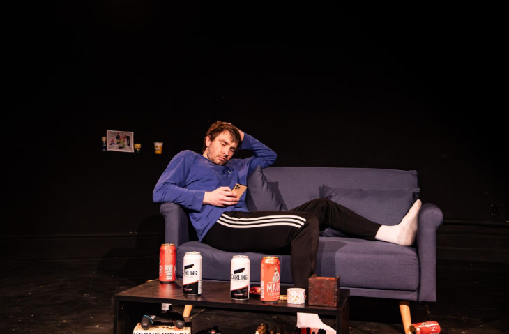 Things to do in London this weekend:  a man lying on a sofa looking at his phone, surrounded by drinks cans