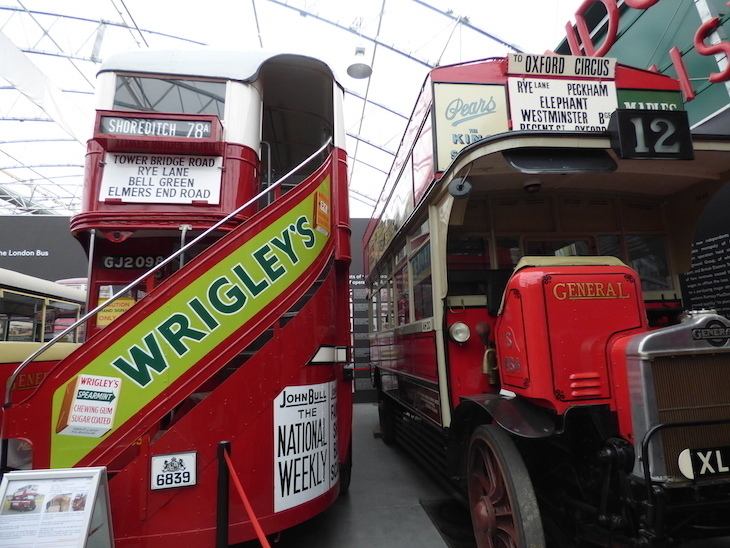 Things to do in London this weekend: two vintage buses parked alongside each other inside the London Bus Museum