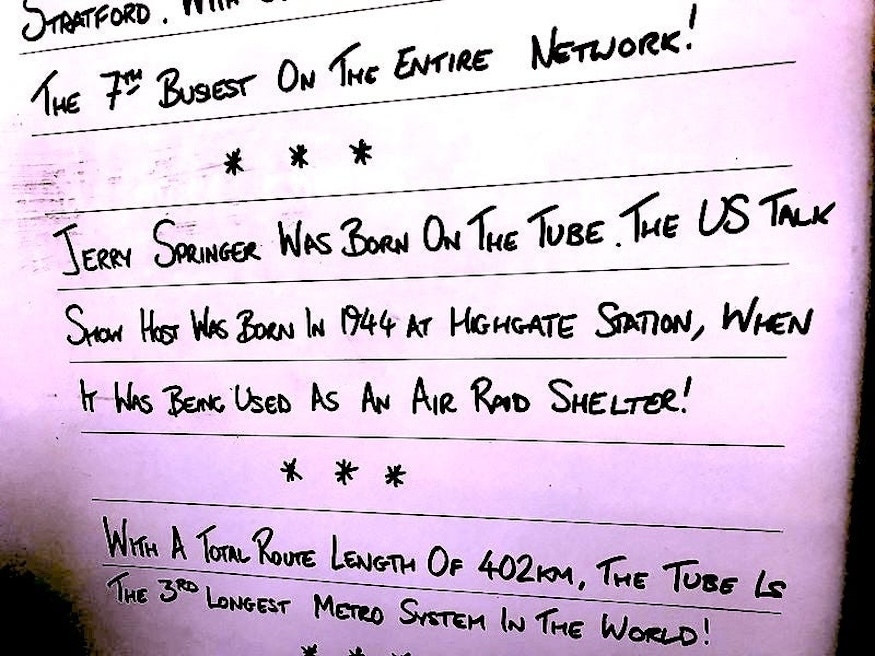 A tube whiteboard with trivia on it.