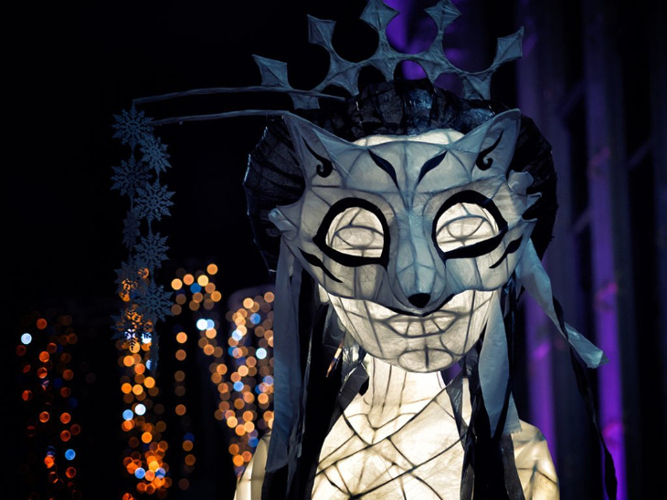 Christmas winter light festivals and trails London 2025: a glowing wolf lantern, part of the Alice in Wonderland winter lantern trail at Hall Place and Gardens