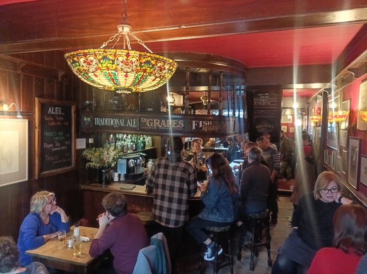 People drinking at the Grapes