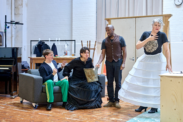 The cast rehearsing