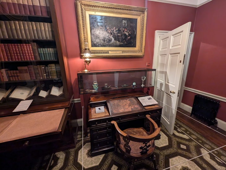 A desk, with books to one side