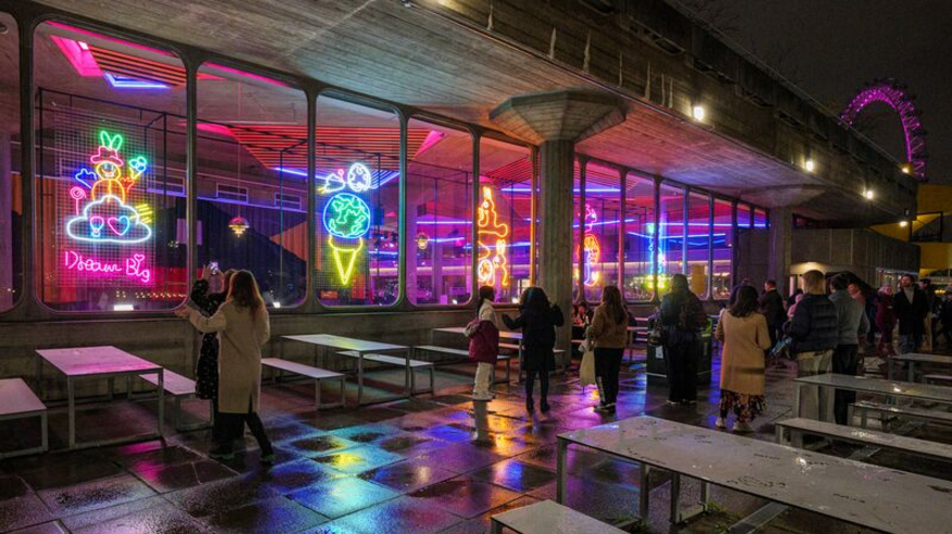 Free budget things to do in London at Christmas 2025: neon artworks on display in the windows of Southbank Centre