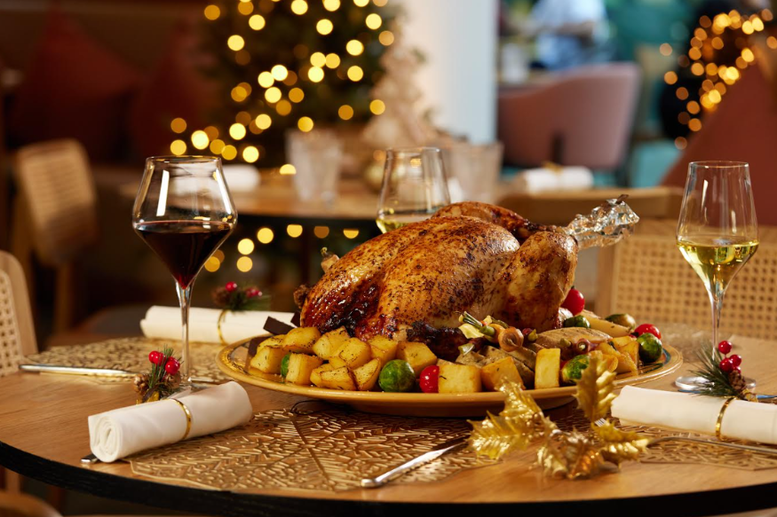 London restaurants on Christmas Day 2025: a roast turkey plated up with vegetables and trimmings