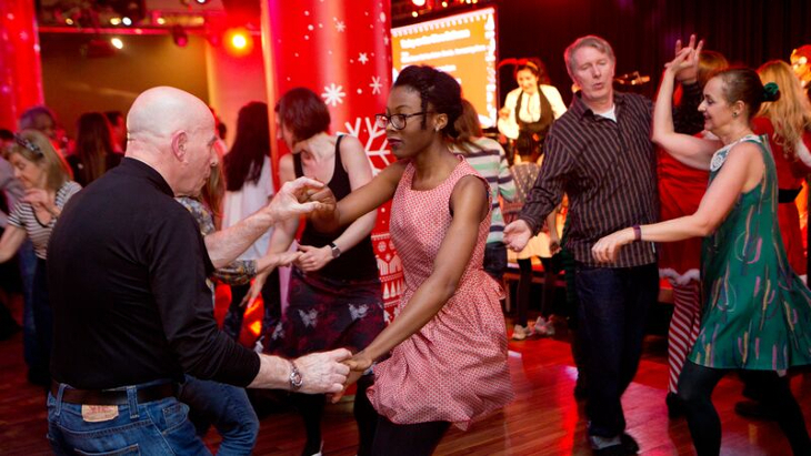 Things to do in London Christmas Eve 2025: people dancing in couples