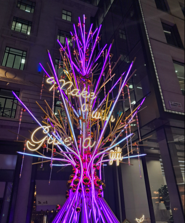 Self-guided Christmas lights walk London 2025: a neon tree