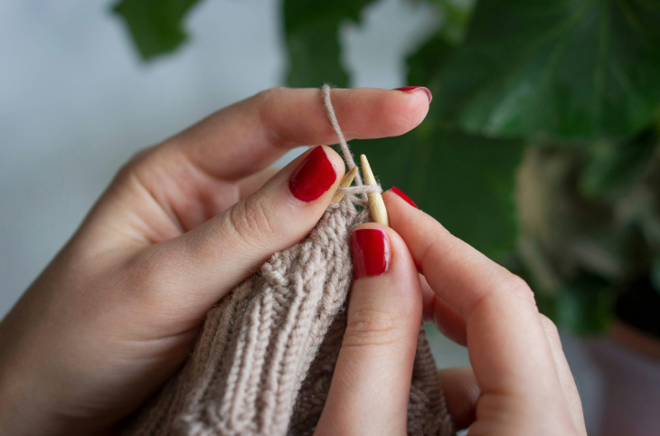 Free events in London: a pair of hands knitting with beige wool