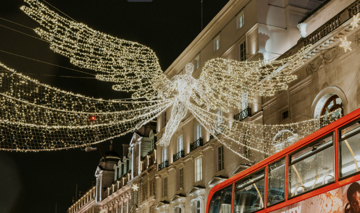 Free budget things to do in London at Christmas 2025: a glowing angel Christmas light above Regent Street