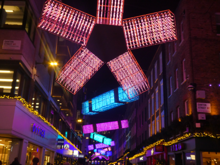 Self-guided Christmas lights walk London 2025: colourful block lighting above Carnaby Street