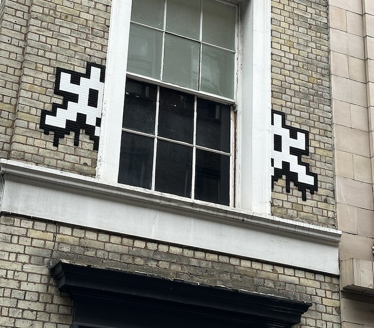 A split INvader in soho