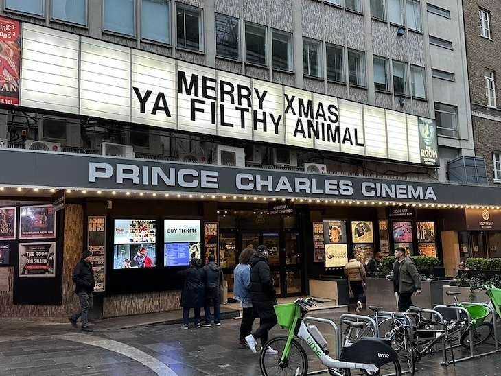 The Prince Charles Cinema in Leicester Square with a quote from Home Alone on the front