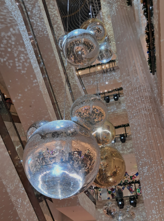 Self-guided Christmas lights walk London 2025:  Mickey Mouse shaped giant disco balls inside Selfridges