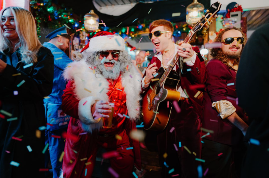 Things to do in London this weekend: people dancing with Santa at a party