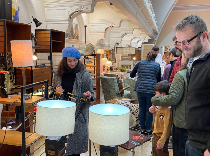 Things to do in London today: people browsing at a flea market