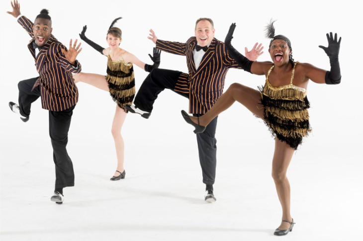What's on in London today: the Jiving Lindy Hoppers in a synchronised pose, in black and gold costumes