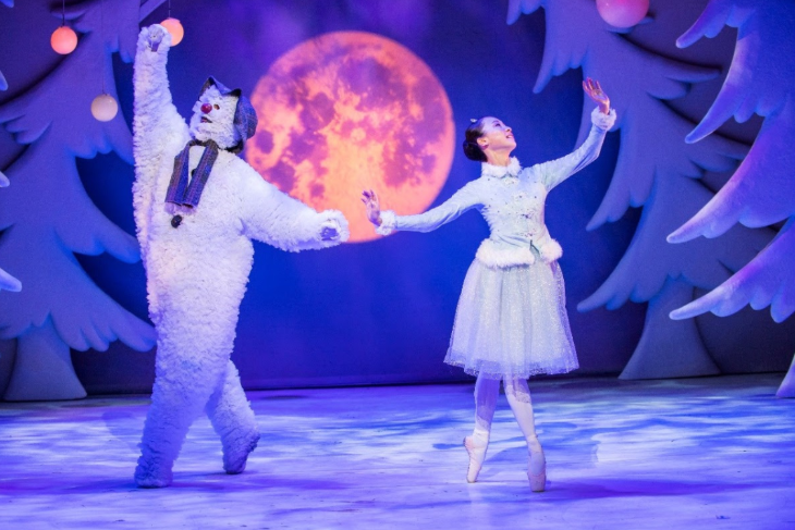 Things to do in London today: the Snowman and a ballet dancer on stage in a snowy forest in The Snowman