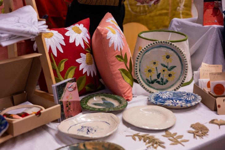 Things to do in London today:  cushions and ceramics on display at a market