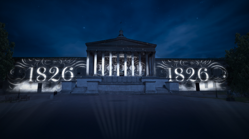 The exterior of the Wilkins building, featuring a portico supported by columns, with "1826" projected onto each side