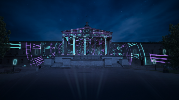 The exterior of the Wilkins building, featuring a portico supported by columns, with a large clockface projection