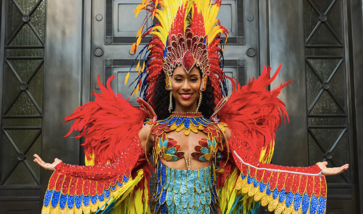 Things to do in London this weekend: a woman dressed in Brazilian samba clothing, including a feathered head dress