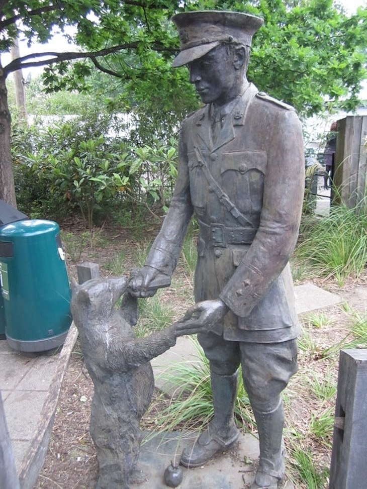 A statue of Winnie the Pooh with soldier