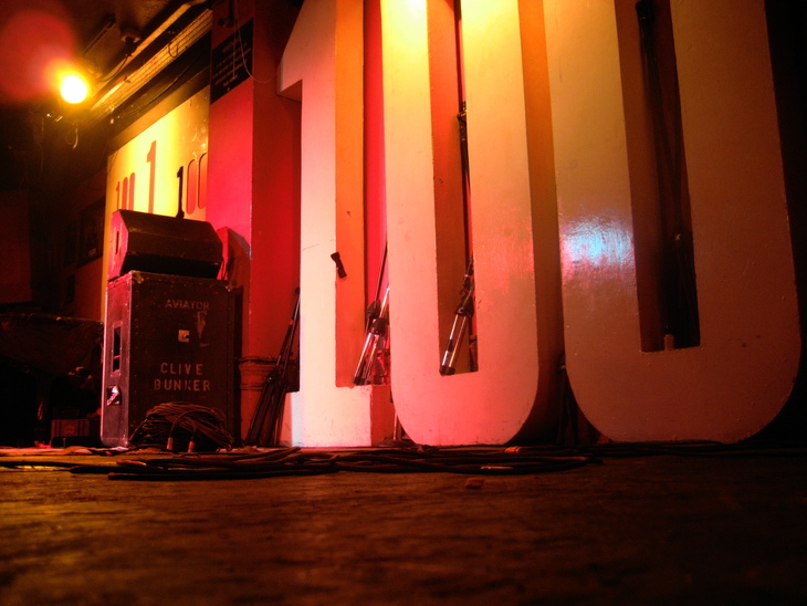 A 100 Club sign on the stage