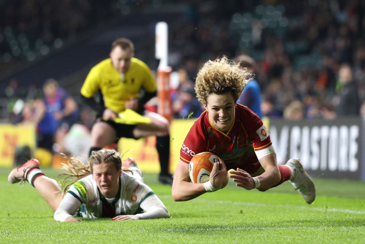 Rugby players - one scoring a try