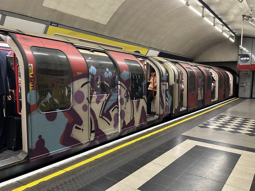 A graffitied Tube train