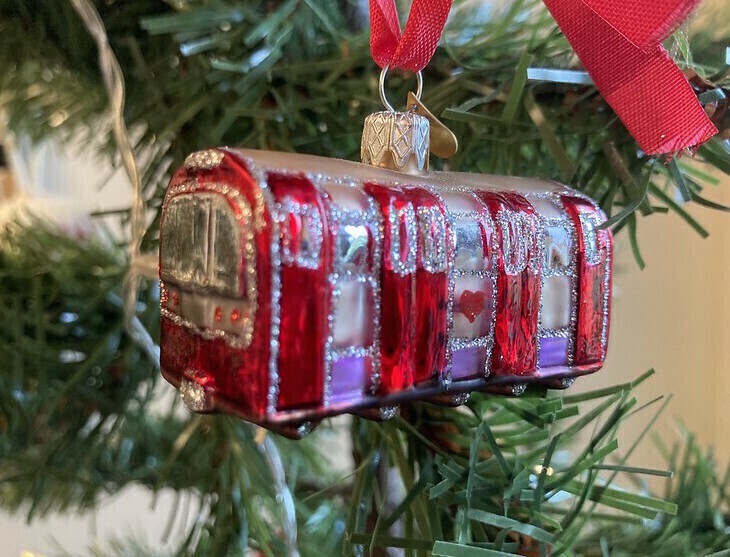 Public transport in London over Christmas: A Tube carriage ornament hanging on a Christmas tree