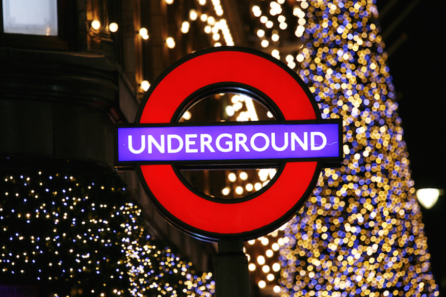 Christmas Day public transport in London: A glowing Underground roundel in front of a Christmas tree