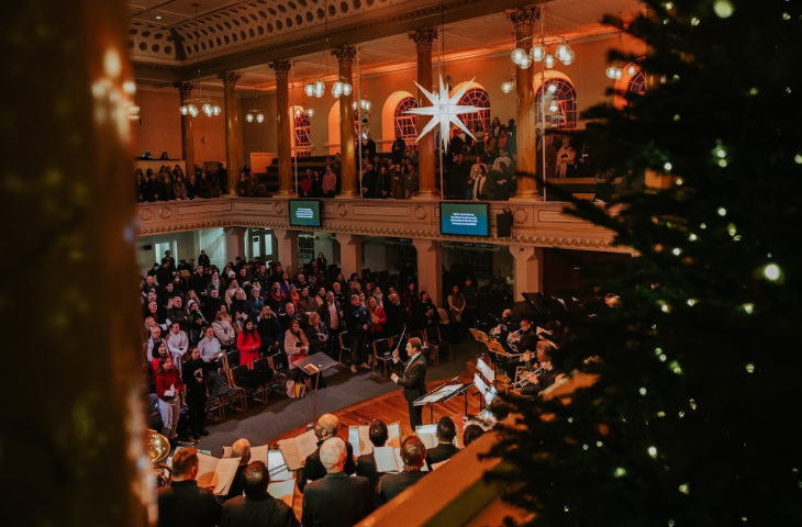 A carol concert taking place in a church