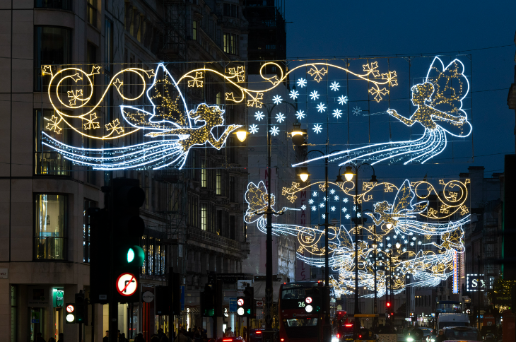 London Christmas lights 2025: fairy themed banner-style Christmas lights above Strand